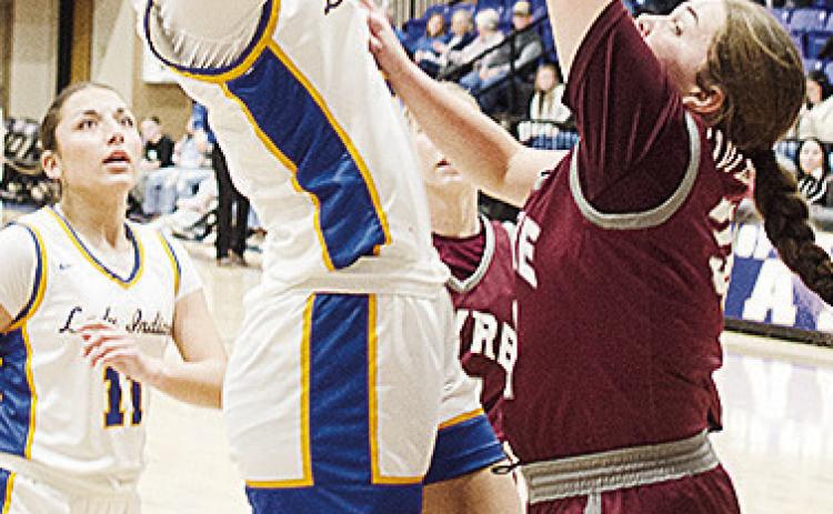 Arapaho-Butler’s Peyton Lambeth shoots the jumper over a Hammon defender while No. 11 Alivia Casas waits to help out in the Lady Indians’ win over Hammon in the first round of the Western Equipment Classic. CDN | Sam Goodwyn