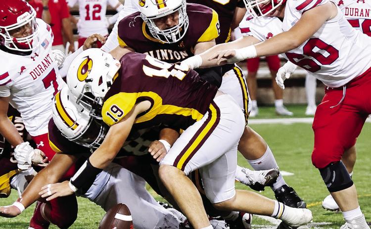 Clinton’s No. 19 Dyson Moss leads a trio of defenders as the Red Tornadoes attempt to jump on the loose ball during Clinton’s win over Durant in the Tornado Bowl. CDN | John Kinsey