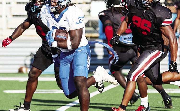 Former Clinton running back No. 33 Zaedon Collins outruns two Community Christian College defenders during Kilgore College’s 55-0 win over the Raiders this past season. CDN | Courtesy photo
