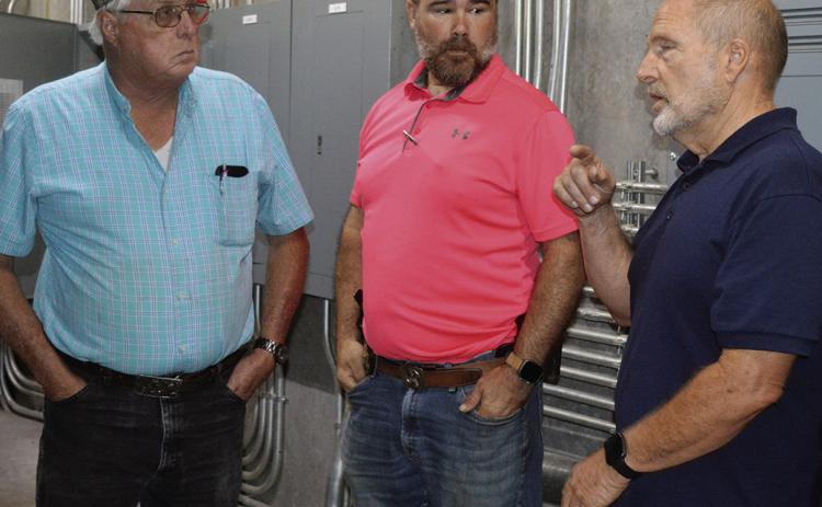 From left, Dist. 3 Commissioner Lyle Miller, Maj. Jeff Maynard, and Dist. 2 Commissioner Bruce Walker discuss the new security system at the Custer County Jail in the server room. CDN | Shiann Dawson