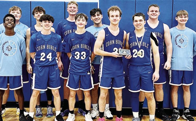 The Corn Bible Academy Crusaders finished third in the second annual Crusader Classic Tournament over the weekend at CBA. Pictured, from left, in front are Rolando Beadle, Alex King, Rylin Zeller, Jaden Zeller and Zack Zybach; back, Coach Zach House, Laws
