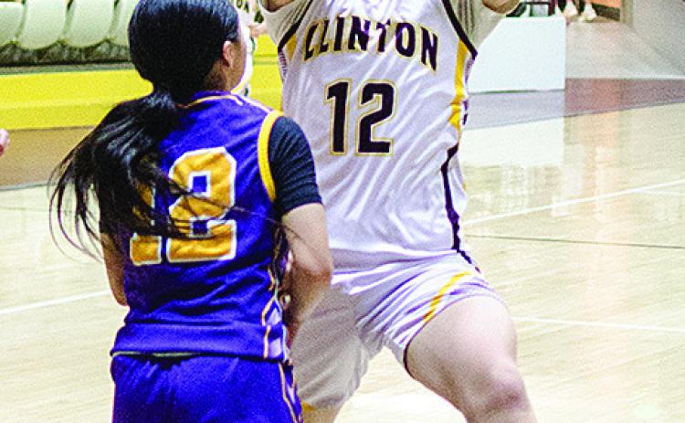 Eighth-grader Liam Lofland eurosteps around an Anadarko defender during the Whirlwinds’ game against the Warriors in the Tornado Dome. CDN |Sam Goodwyn