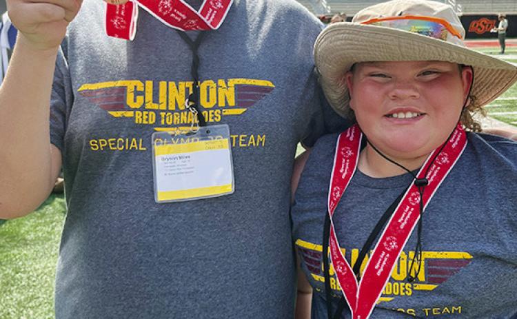 Kenneth Williams, left, and SJ Adkinson show off their bronze medals after competing in the Unified Bocce Ball at the Special Olympics Summer State Games last week at Oklahoma State University. CDN |Courtesy Photo