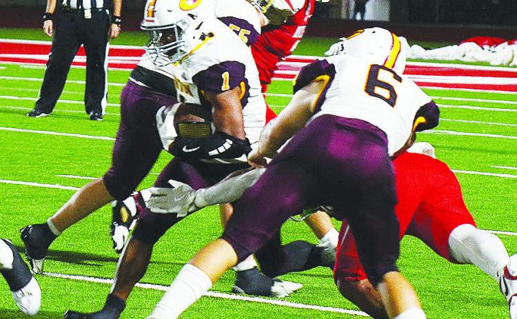 Clinton’s No. 6 Benton Bridgeman and No. 55 Bryson Snider provide key blocks for No. 1 Derren Hester as he carries the ball up the field during the Red Tornadoes’ road game Thursday against Cache. CDN | Micah Ashcraft