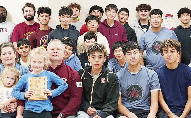 Clinton boys’ soccer coach Gene Ray celebrates with his family and team after being named the United Soccer Coaches 2024 State Coach of the Year for Oklahoma High School Boys Small Public Schools. Pictured in front, from left, are Miguel Hernandez, Trev