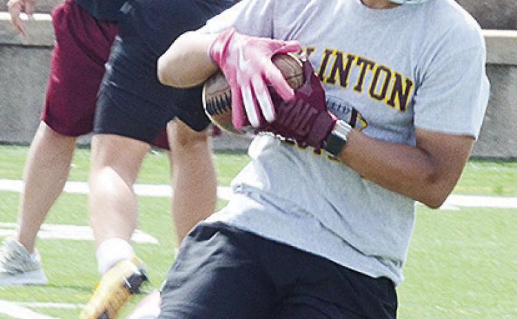 Clinton’s Jaden Potter catches the ball and turns up field during a spring practice in the Tornado Bowl. CDN | Sam Goodwyn