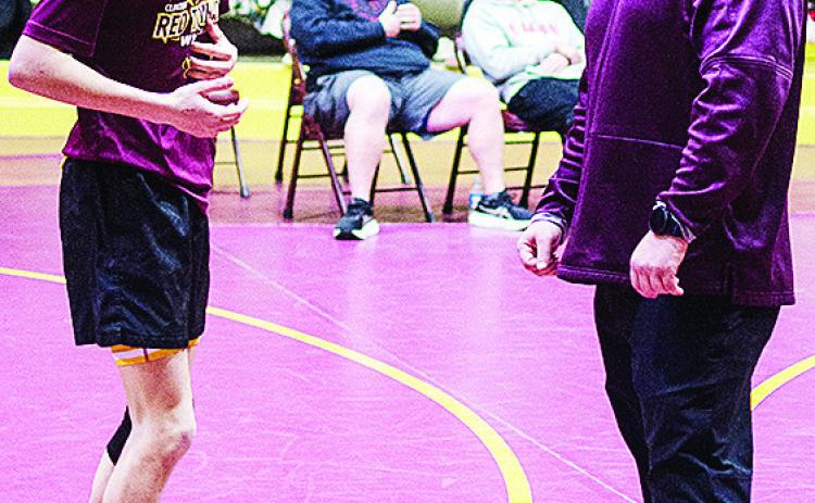 CDN | Sam Goodwyn Coach Austin Long, right, talks with Carsen Smith prior to the Hub City Tournament held at the Tornado Dome.