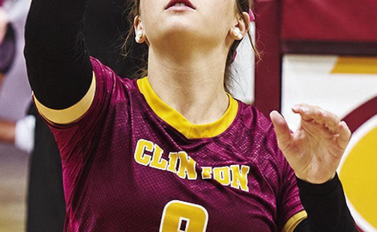 Clinton’s Lillian Heerwald works on hitting the ball during warm-ups prior to a volleyball game this season. CDN | Sam Goodwyn