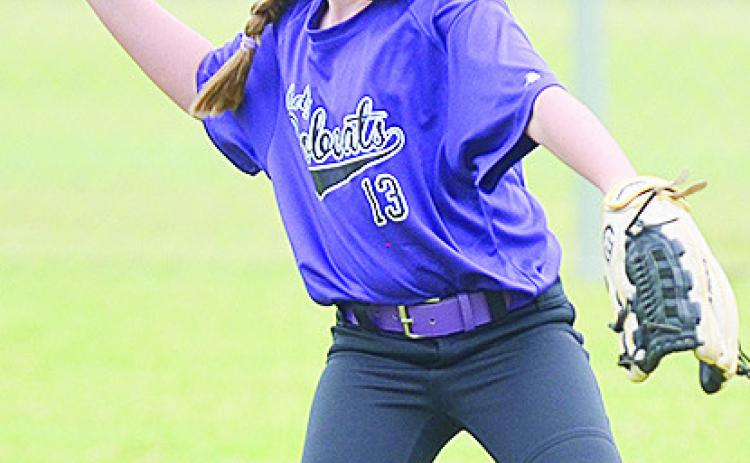Hydro-Eakly’s Ava Abbott focuses on her target, as she prepares to throw the ball during the Bobcats’ game against Lexington to open the OK Kids 8U Softball State Tournament Wednesday at Schumacher Fields at Acme Brick Park. CDN | Sam Goodwyn