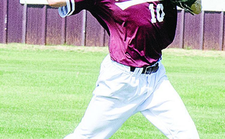 No. 10 Snider Dowdell throws the ball in during Clinton’s game Wednesday against Elk City. CDN | Sam Goodwyn