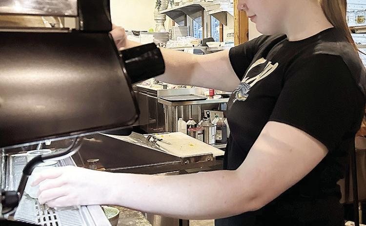 CHS alumna Chloe Bailey whips up an espresso for a customer while working a shift at Strayhouse Kitchen + Coffee. CDN | Micah Ashcraft