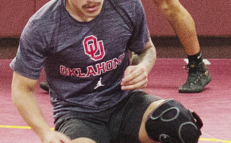 Clinton’s Tristan Cardenas works on his movements during wrestling practice. CDN | Sam Goodwyn