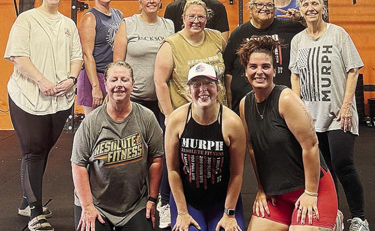 A recent crossfit class is all smiles after completing a workout at the Resolute Gym. Pictured kneeling, from left, are Melissa Gordon, Amy Hyde and Reagan Calvert; second row, Morgan Sprague, Heather Harding, Lori Green, Kelli Oliver, Mary Oliver and Cat
