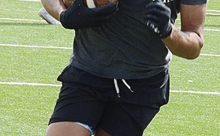Sophomore JJ Ruiz carries the ball during practice Monday. CDN | Sam Goodwyn