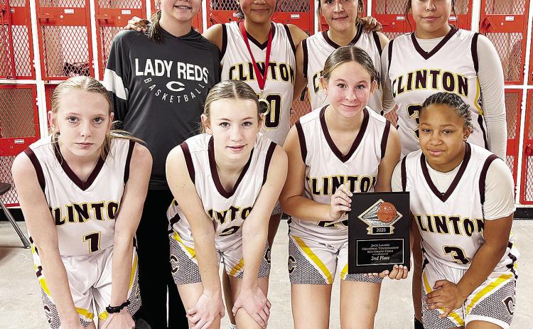 Clinton’s eighth-grade girls’ basketball team takes a team photo after finishing as runner-up in the Yukon Tournament last weekend. Pictured, from left, in front are Destiny Krewall, Hannah Miller, Sydnee Pugh and Ale-Jia Lacy; back, Quincy Matlock, V