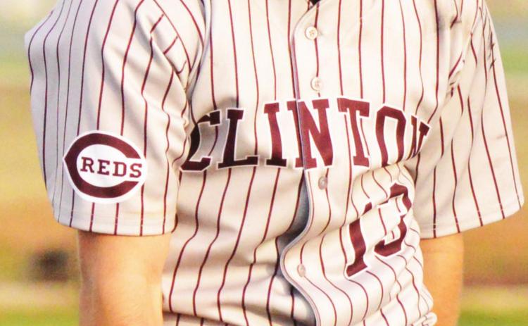 Clinton senior pitcher Manning McAtee celebrates after posting another zero on the scoreboard in the Reds’ win over Elk City. CDN | Collin Wieder