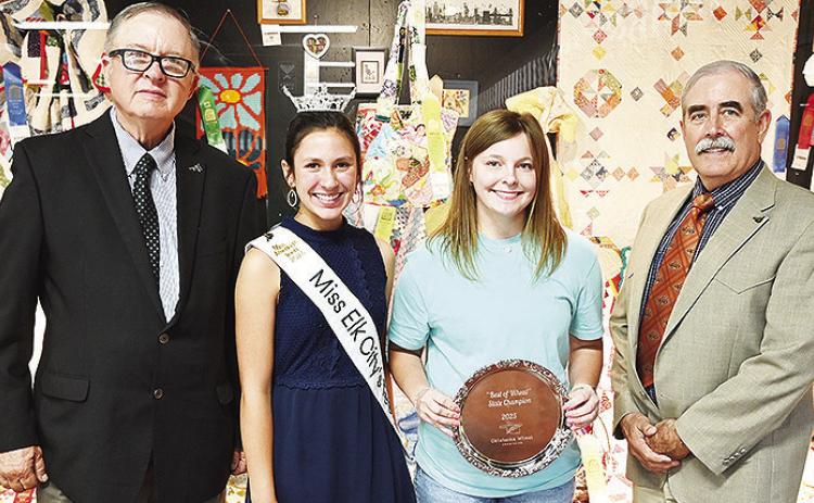From left, Oklahoma Wheat Commissioners Chairman Raymond Parrish, Miss Elk City Teen Bailey Gossen, Arapaho-Butler’s Malley Baker and David Gammill recognize Baker’s champion tray for winning “Best of Wheat” bread making contest at the Oklahoma St