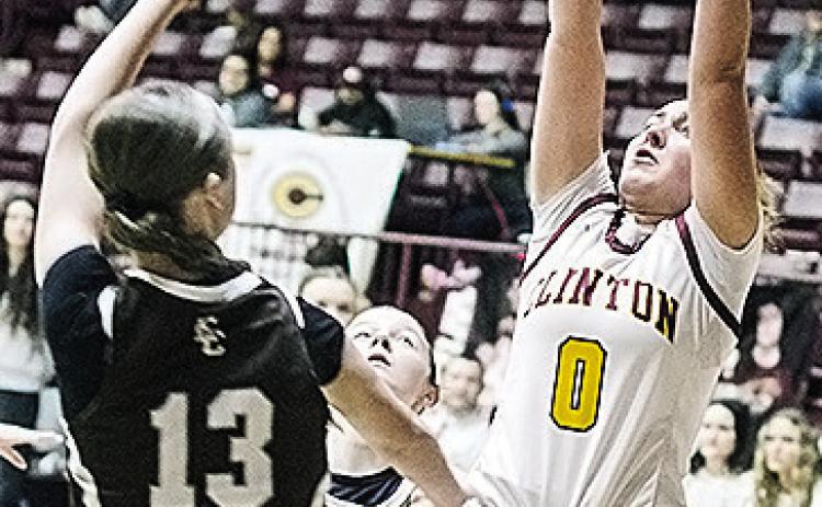 Clinton’s Laney Anderson, right, shoots over the Elk City defender Saturday during the Lady Reds’ home game. CDN | Sam Goodwyn