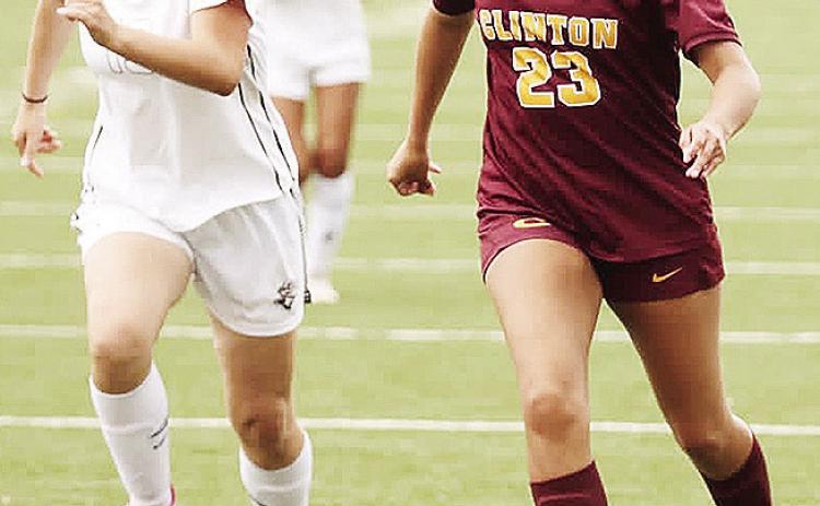 Clinton’s Audrina Trout, right, outraces the Elk City defender during the Lady Reds’ home game against the Elkettes in the Tornado Bowl. CDN | Steve Wheeler