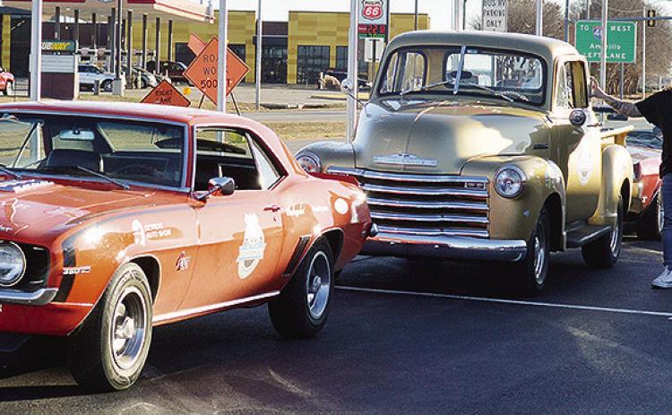 America’s Automotive Trust Communications Director Jake Welk steps out of just one of the several classic vehicles in a caravan stopping at the Oklahoma Route 66 Museum while traveling the entire length of Route 66 ahead of the car’s display at the De