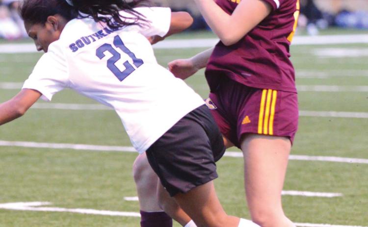 Clinton sophomore forward Ali Rodelo fights for the ball
