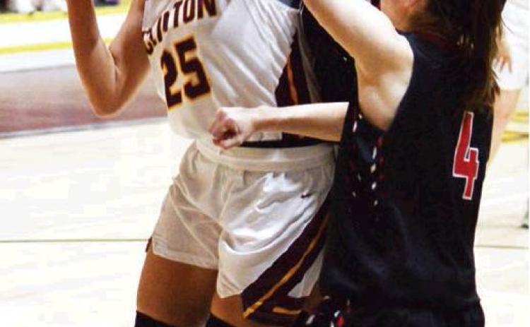 Clinton boys win close one, Lady Reds fall in double overtime
