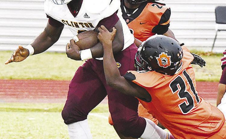 Clinton dominates Douglass in bad weather