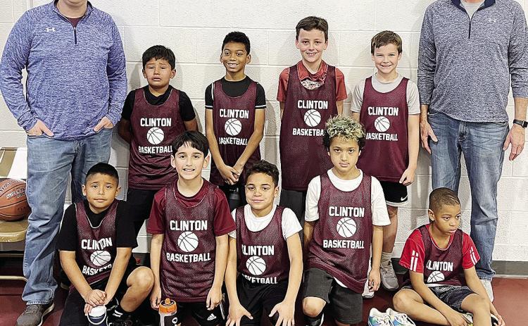 The Clinton third-grade basketball team poses to take a team photo. Pictured, front from left, are Jacob Guzman, Sebastian Ringo, Jaelynn Lee, Mehkai Ford and Anthony Bennett; back, Coach Kent Jaggers, Jarod Moss, Jessiah Reed, Copeland Flaming, Greyson J