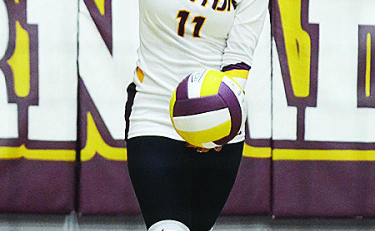 Clinton’s Karol Bonilla prepares to serve the ball during the Lady Reds’ home game against Weatherford. CDN | Sam Goodwyn