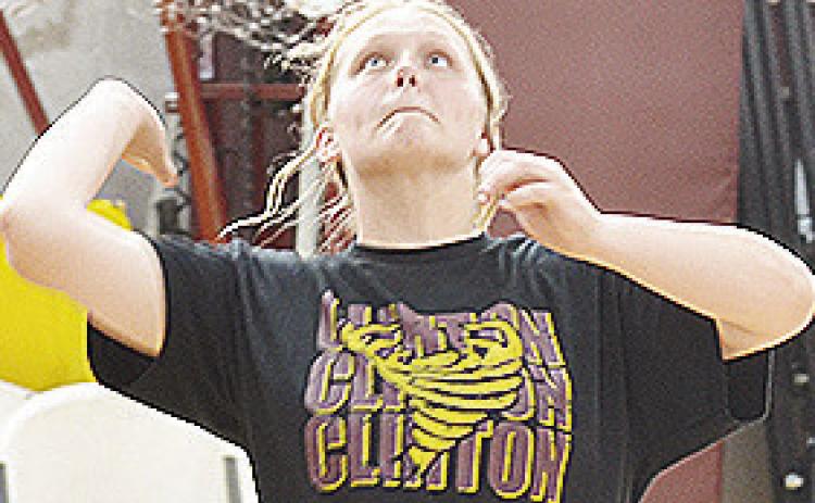 Clinton’s Sammi Hammans focuses on the ball as she prepares to serve it during practice Tuesday in the practice gym. CDN | Sam Goodwyn