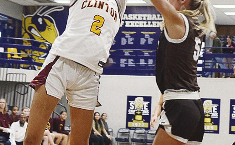 No. 2 Ella Redshin goes up for a layup attempt over the Elk City defender during Clinton’s Class 4A Regional Tournament basketball game against the Elkettes Friday in Kingfisher. CDN | Sam Goodwyn