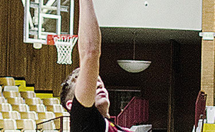 Clinton’s Wes Switzer goes up for a layup during practice in the Tornado Dome. CDN | Sam Goodwyn