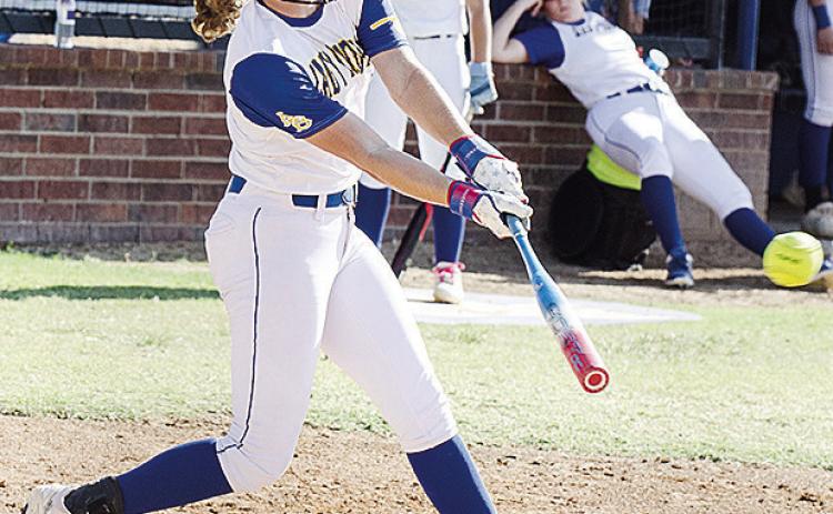 Arapaho-Butler’s Dalaynie Lee blasts the ball to the outfield during the Lady Indians’ blowout win Thursday at home over Arnett. CDN | Sam Goodwyn