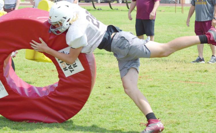 Clinton opens spring practice with energy jolt