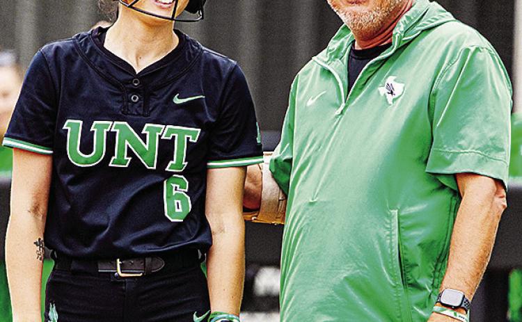 University of North Texas Coach Jon Hunter, right, chats with Elizabeth Moffitt during a game. UNT Athletics
