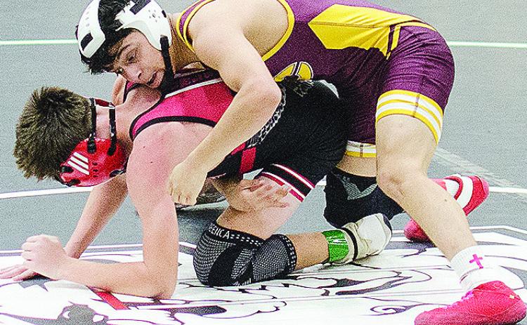 Clinton’s Matthew Bermea, top, holds his opponent to the mat during the first day of the Max Dippel Memorial Wrestling Tournament Friday in Weatherford. CDN | Sam Goodwyn