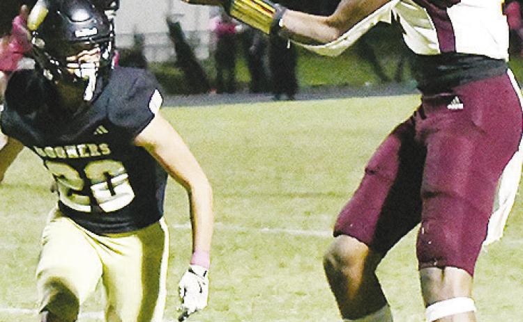 Clinton’s No. 17 DJ Lister focuses on the ball as he catches it before a defender gets to him during the Red Tornadoes’ road win over Woodward. CDN | John Kinsey
