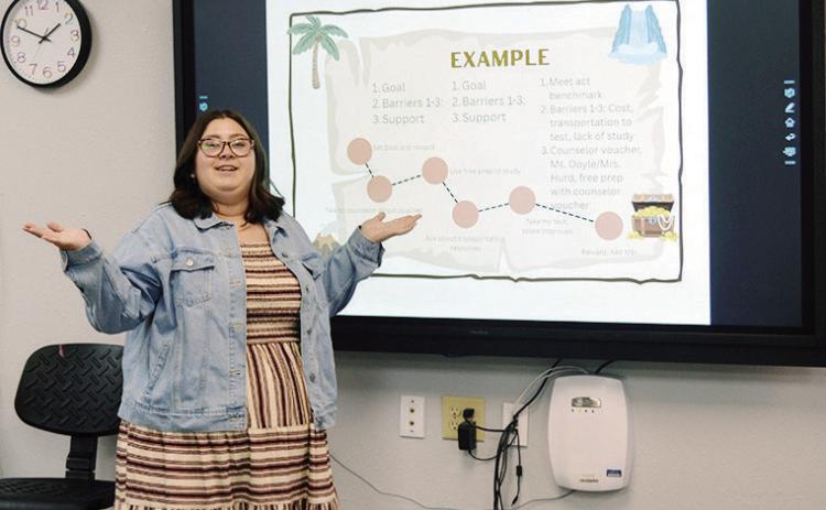 Kaylei Doyle explains the treasure map activity recently at the JAG (Jobs for America’s Graduates) classroom in CHS. The activity has students fill out a goal they wish to accomplish and plot points to work toward achieving that goal. CDN | Christian Jacobsen