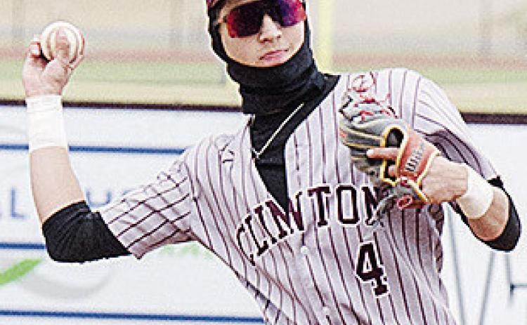 Clinton’s Declan Brown throws the ball back to the pitcher in the Reds’ game against Kingfisher. CDN | Sam Goodwyn