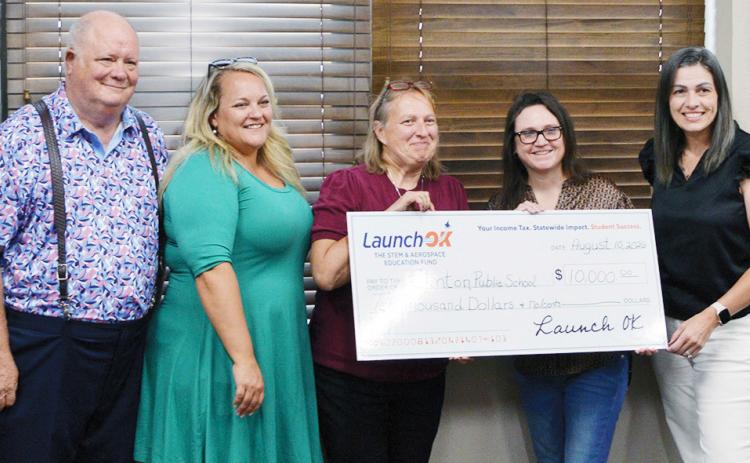 LaunchOK, the STEM and aerospace education fund, awarded Clinton Public Schools with a $10,000 check. Pictured from left are CHS science teachers Joe Hayes, Whitney Misak, and Lori Gwyn; Senior Manager of Strategic Outreach for LaunchOK Valerie Philips; and CHS Principal Michelle Sorter. CDN | Christian Jacobsen