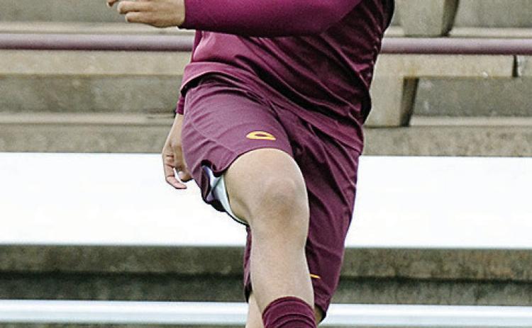 Clinton’s Aaron Lopez kicks the ball during warmups prior to the Red Tornadoes’ home game against the Douglass Trojans. CDN | Sam Goodwyn