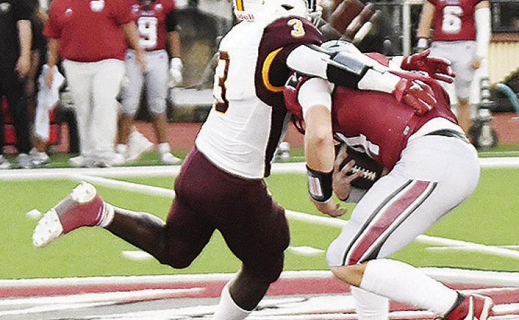 No. 3 Zaedon Collins tackles the Eagles’ ball carrier during the “Custer County Conflict” in Weatherford. CDN | John Kinsey