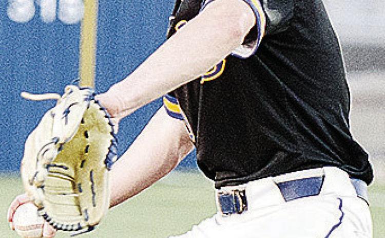 CDN | Sam Goodwyn Arapaho-Butler’s Jiles Southall goes into his wind up as he prepares to pitch during the Indians’ game against Fletcher during the spring season.