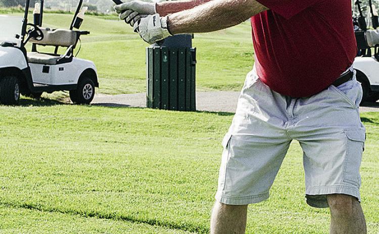 Mike Rollins begins his swing as he plays a round of golf at Riverside Golf Course. CDN | Sam Goodwyn