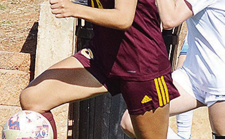 Clinton’s Leila Pete outraces the Newcastle Racer during the Lady Reds’ JV game in the Tornado Bowl. CDN | Sam Goodwyn