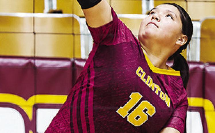 Clinton’s Mallory Burns serves the ball during the Lady Reds’ home game Tuesday against Lawton Eisenhower. CDN | Sam Goodwyn