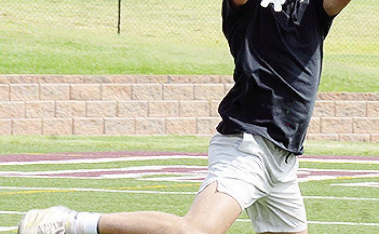 Dyson Moss jumps to snag the ball during a drill in practice at the Tornado Bowl. CDN | Sam Goodwyn