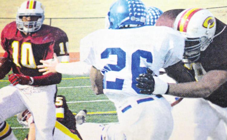 Clinton running back Willie Ford, No. 10, follows a block by teammate Ryan Hall. CDN | File Photo