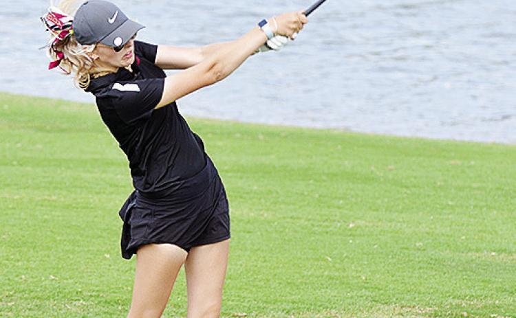 Clinton’s Addyson Littke hits the ball during the Class 4A State Tournament last year in Shawnee. CDN | Sam Goodwyn