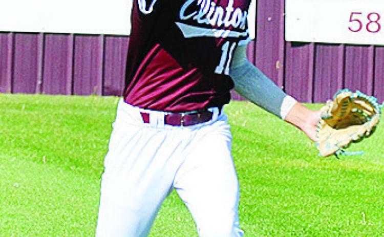 Clinton’s Ben Daugherty hurls the ball back into the infield during the Reds’ Senior- Day game Monday against Kingfisher. CDN | Sam Goodwyn